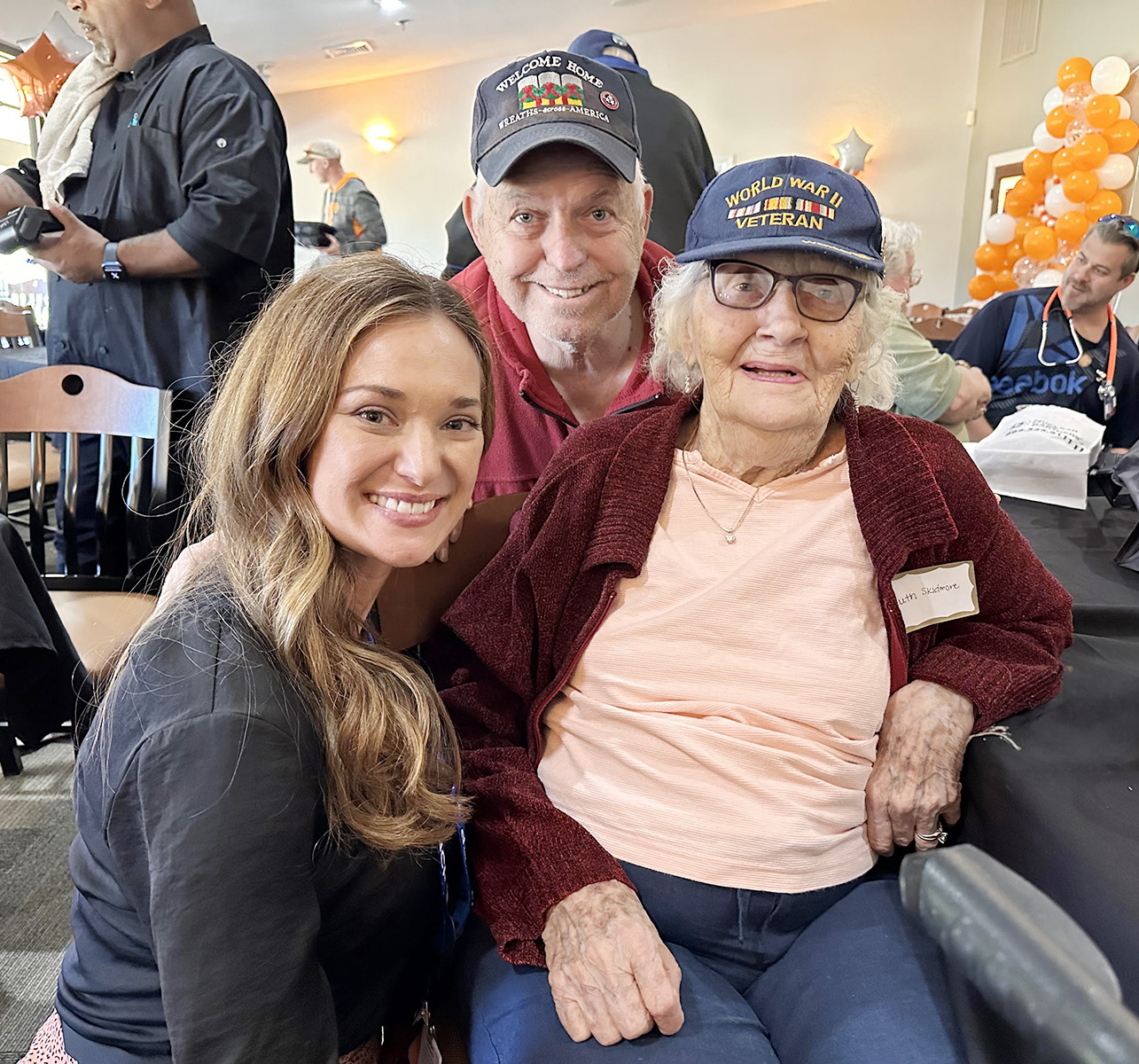 Jenna Noem, Founder and CEO sitting with Nuclear Care Partners Patients